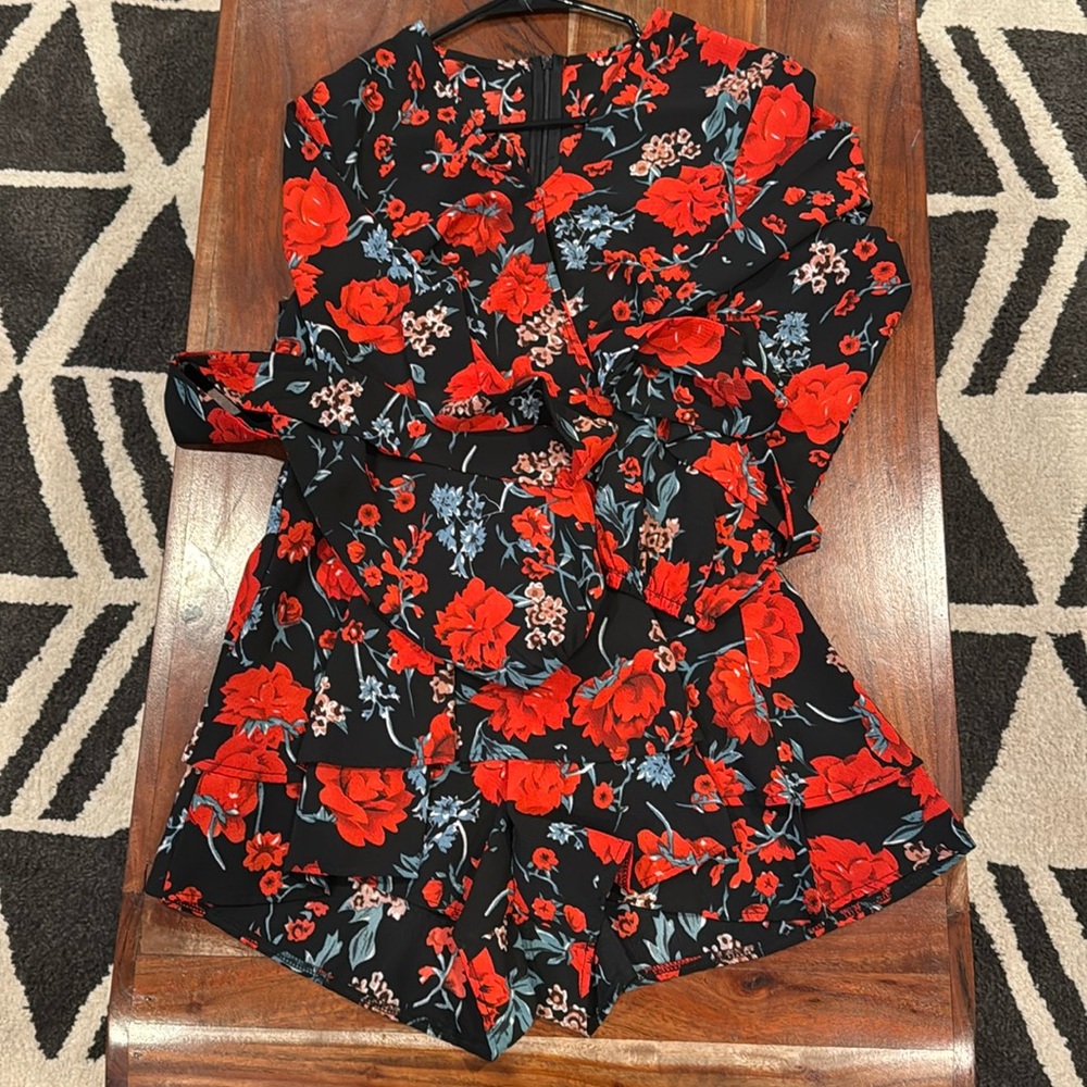 SHEIN, black romper, zip up back. Tie in back. V neck. Red and green flowers.